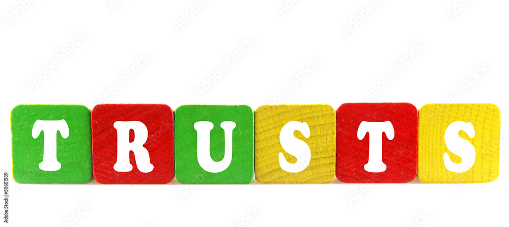 trusts - isolated text in wooden building blocks trusts - isolated text in wooden building blocks
