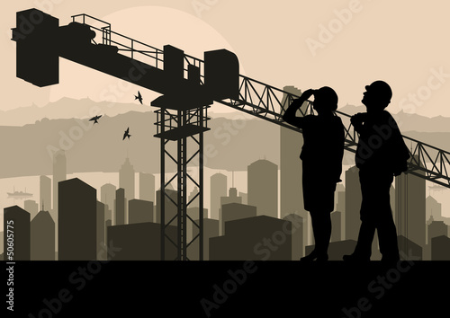 Engineer and construction site manager watching skyscraper build