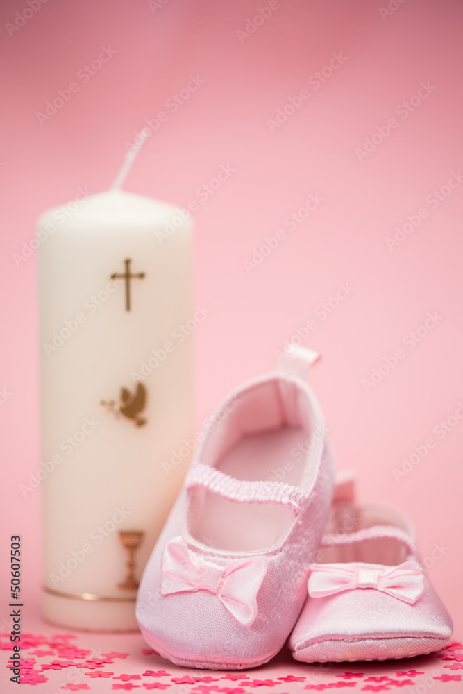 Pink baby booties with christening candle Pink baby booties with christening candle