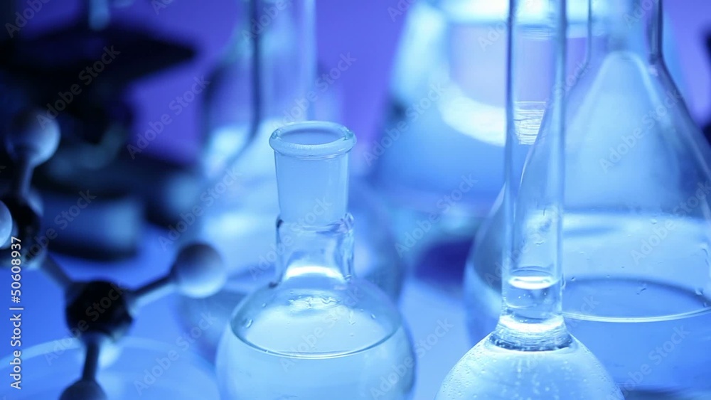 beakers with liquid for experiment in laboratory. dolly shot. beakers with liquid for experiment in laboratory. dolly shot.