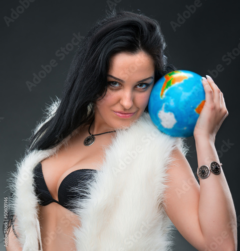 Beautiful woman holding a globe