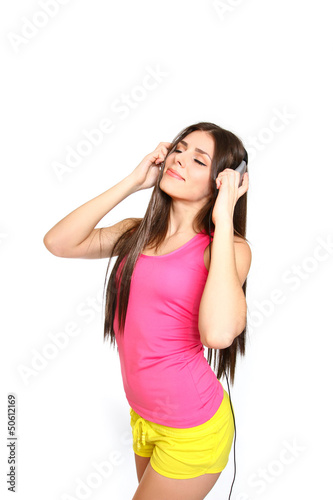 Happy young woman listening to music with closed eyes on white b