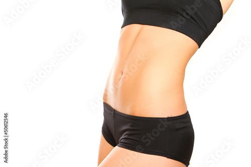 Slim female belly on white background