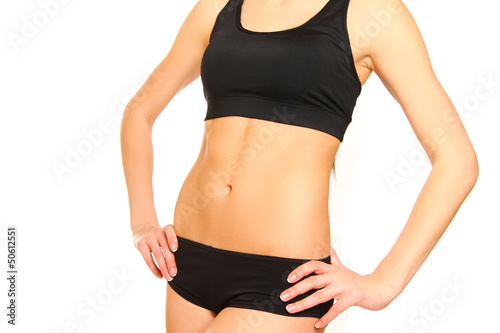 Slim tanned woman's body isolated over white background