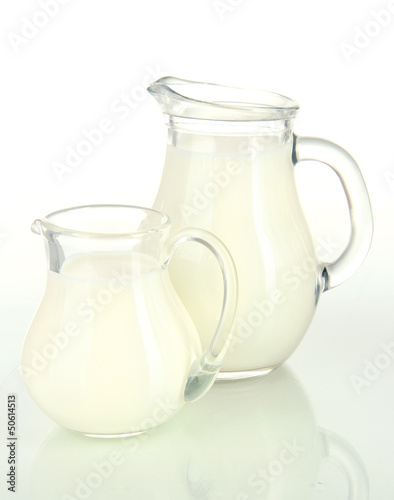 Two jugs of milk isolated on white