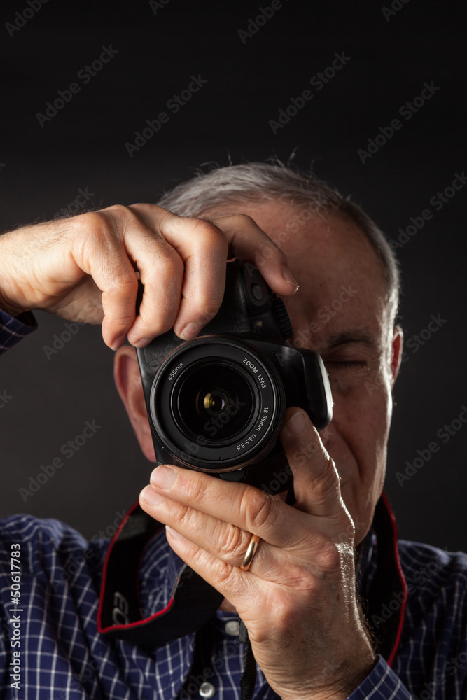 Old man taking a picture