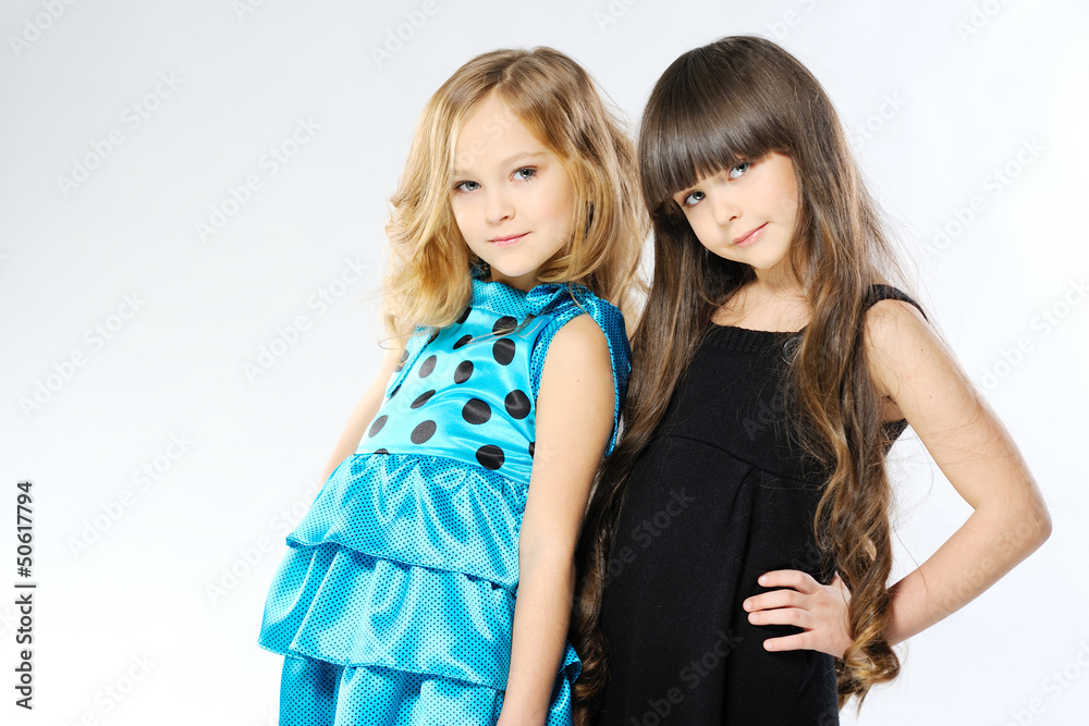 Portrait of two girls in the studio