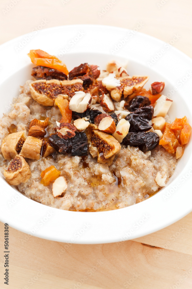 oatmeal with raisins, nuts and maple syrup oatmeal with raisins, nuts and maple syrup