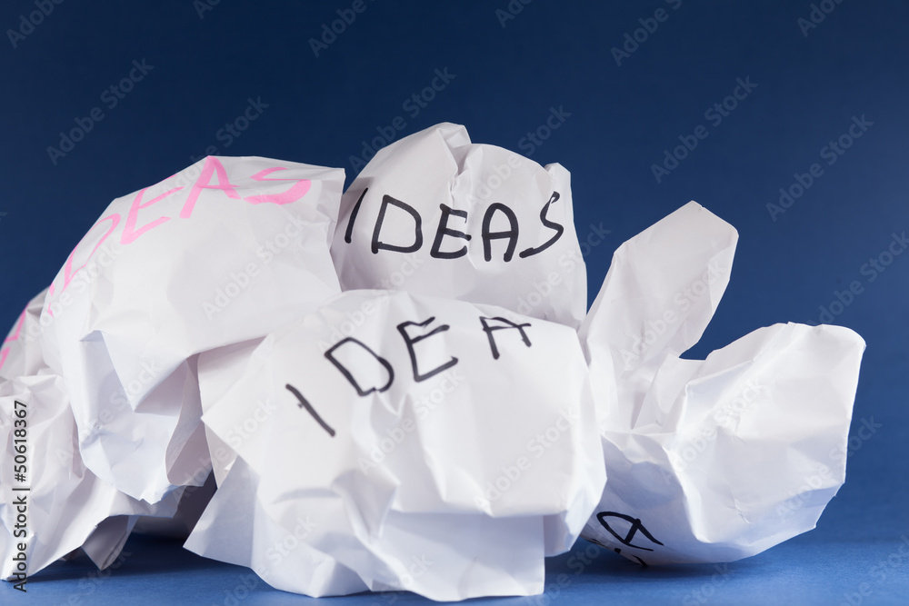 Crumpled piece of paper with idea written on it Crumpled piece of paper with idea written on it
