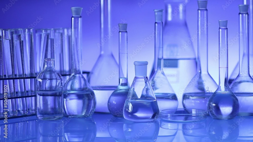 beakers with liquid for experiment in laboratory. dolly shot. beakers with liquid for experiment in laboratory. dolly shot.