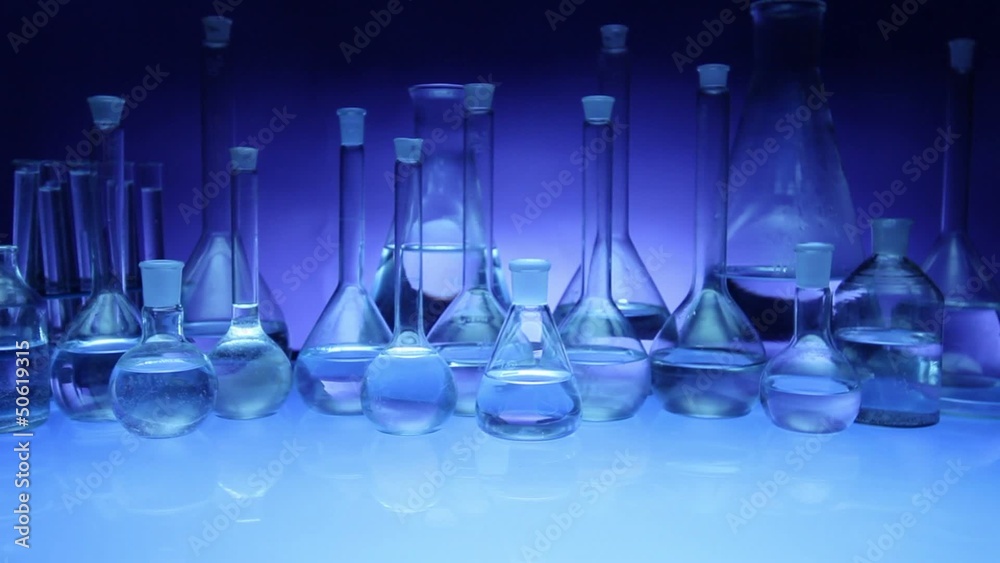 beakers with liquid for experiment in laboratory. dolly shot.