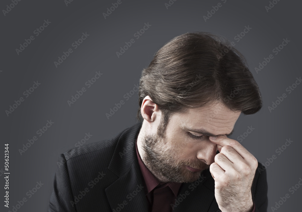 Forty years old depressed and overwhelmed businessman Forty years old depressed and overwhelmed businessman