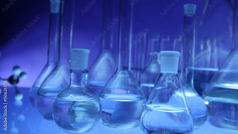 beakers with liquid for experiment in laboratory. dolly shot. beakers with liquid for experiment in laboratory. dolly shot.