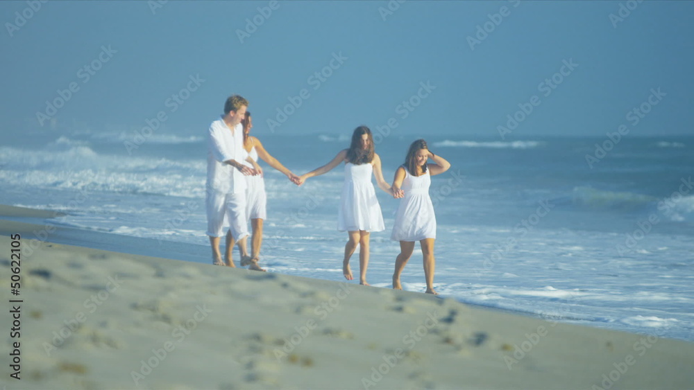 Happy Caucasian Family Walking Outdoors Wet Sand on Beach Happy Caucasian Family Walking Outdoors Wet Sand on Beach