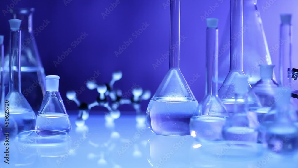 beakers with liquid for experiment in laboratory. dolly shot. beakers with liquid for experiment in laboratory. dolly shot.