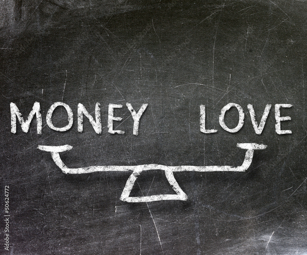 Fototapeta premium Balance of money and love on blackboard 