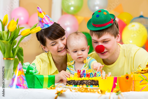family celebrating first baby's birthday