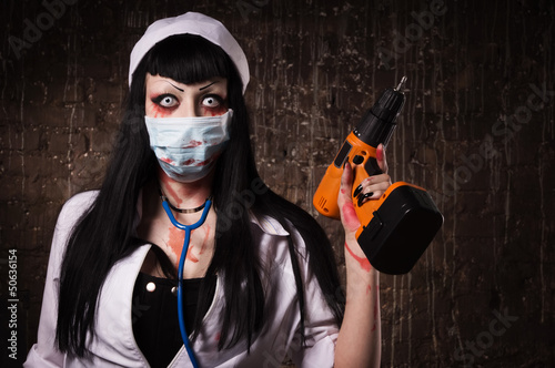 Cuadro en lienzo Crazy dead nurse with drill in the hand