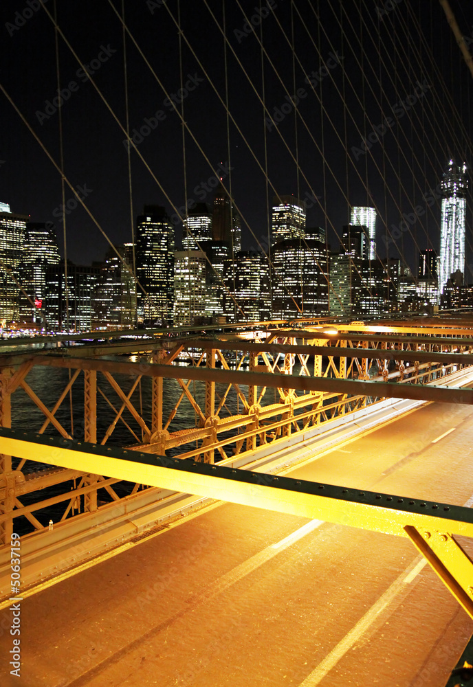 Traffic in the night in the Brooklyn Bridge, New York