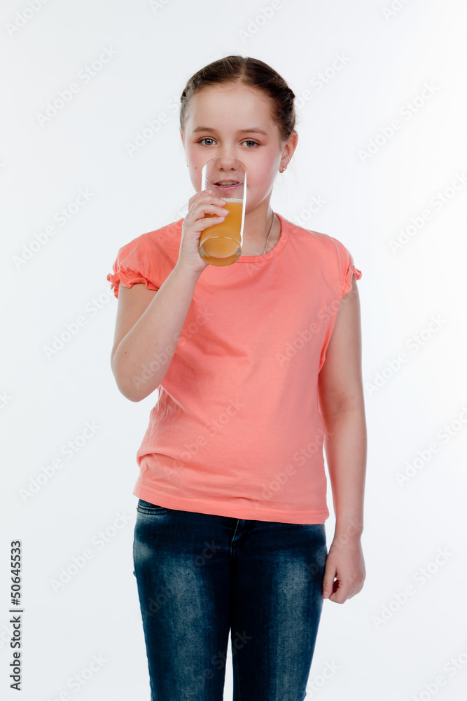Small and beautiful girl with a glass of juice Small and beautiful girl with a glass of juice