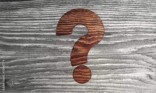 Biological question mark in a wooden background