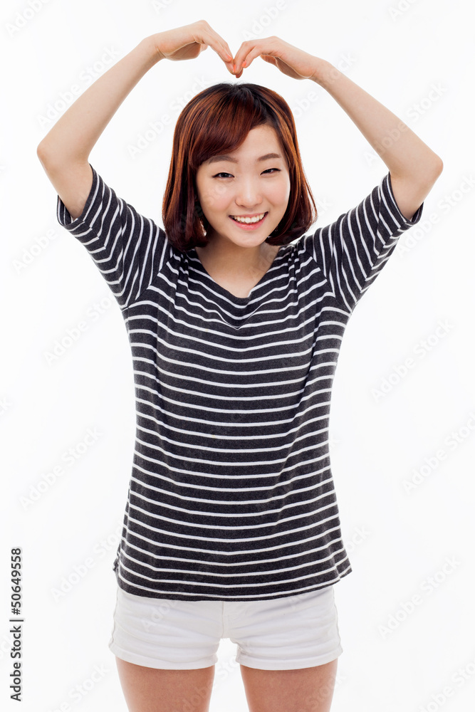 Beautiful Asian casual woman show heart shape. Beautiful Asian casual woman show heart shape.