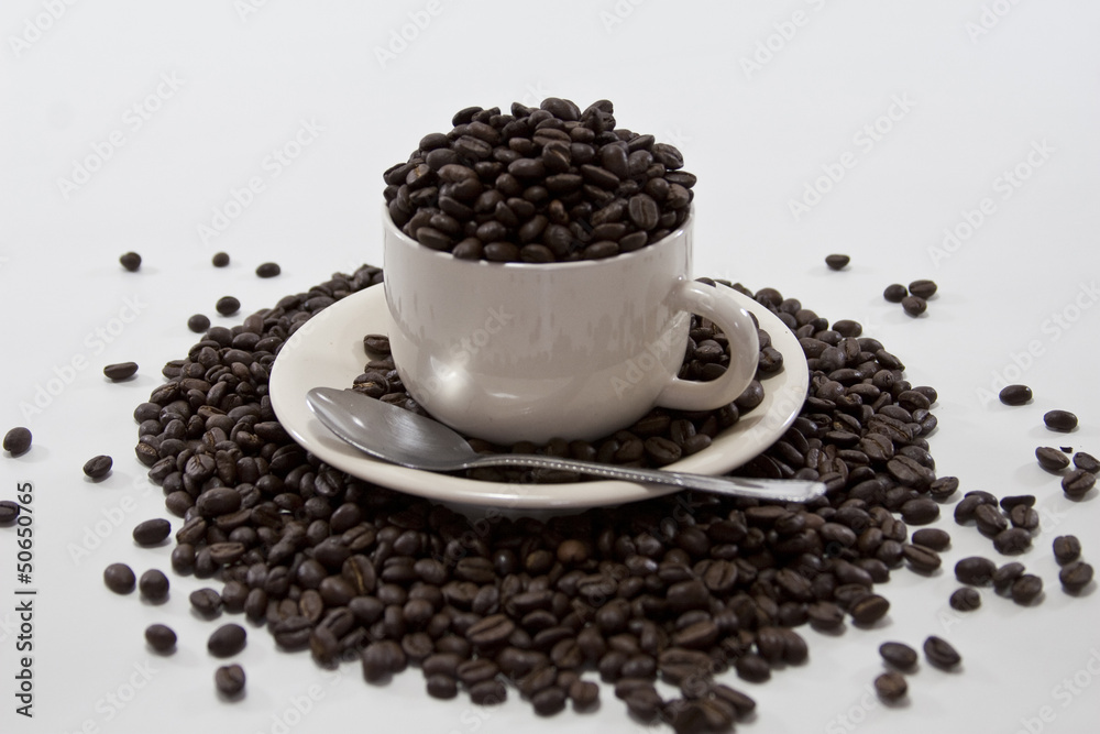 Coffee Beans Overflow Coffee Cup on Isolated White Background Coffee Beans Overflow Coffee Cup on Isolated White Background