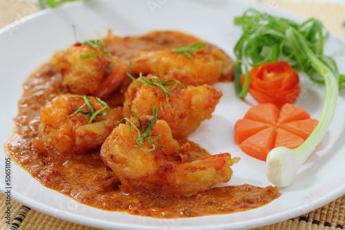 Fried prawn balls in red curry.