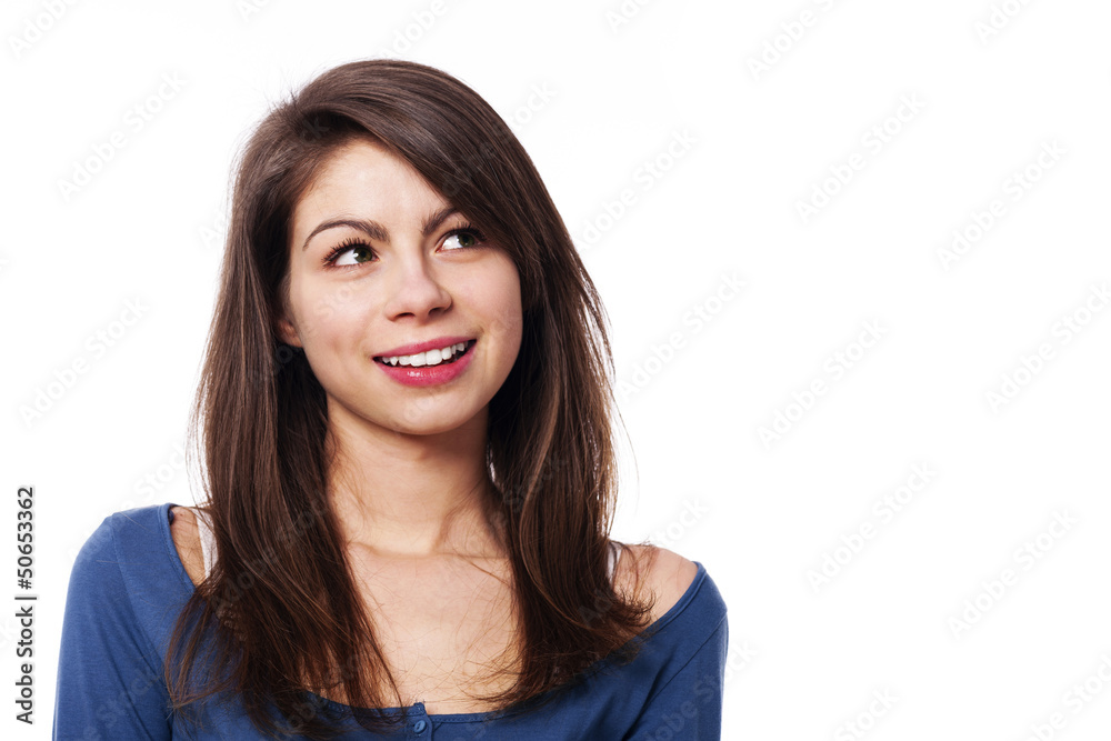 Young smiling woman looking up