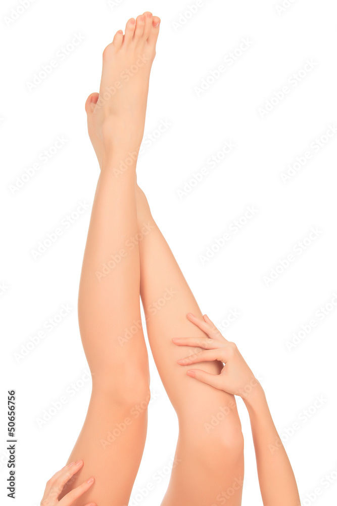 Smooth skin on female legs. White background Smooth skin on female legs. White background