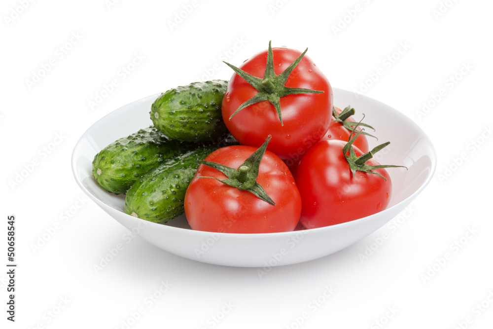 fresh greenhouse cucumbers and tomatoes in bowl fresh greenhouse cucumbers and tomatoes in bowl