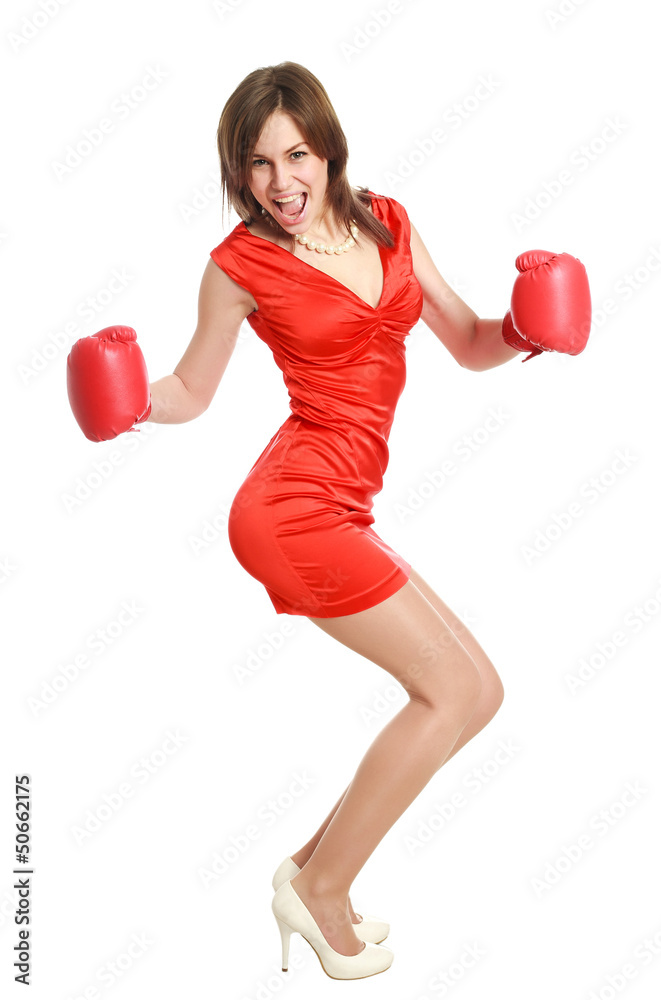 Woman in red, wearing boxing gloves, isolated on white Woman in red, wearing boxing gloves, isolated on white