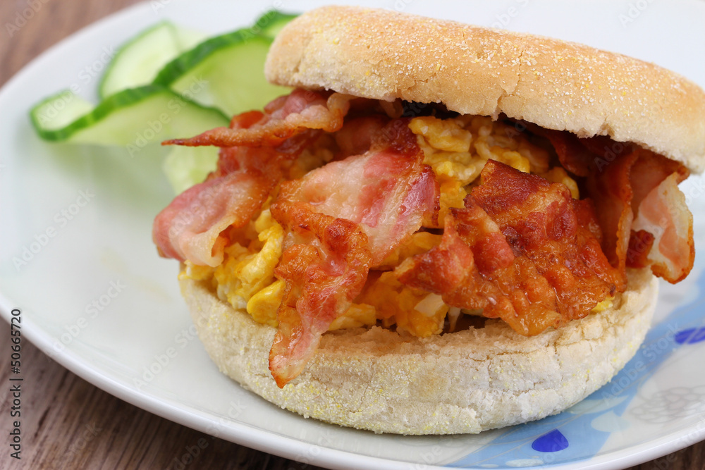 English muffin with crispy bacon and scrambled egg English muffin with crispy bacon and scrambled egg