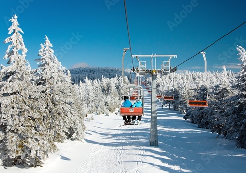 chair lift on mountain for downhill skiers photo