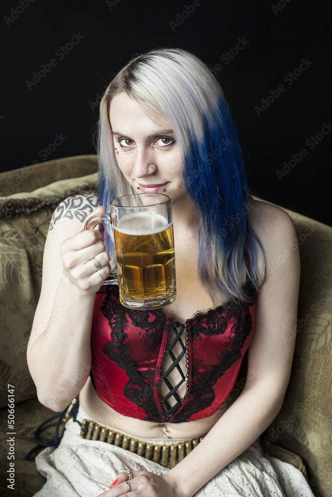Beautiful Young Woman with Blue Hair Drinking Beer Beautiful Young Woman with Blue Hair Drinking Beer