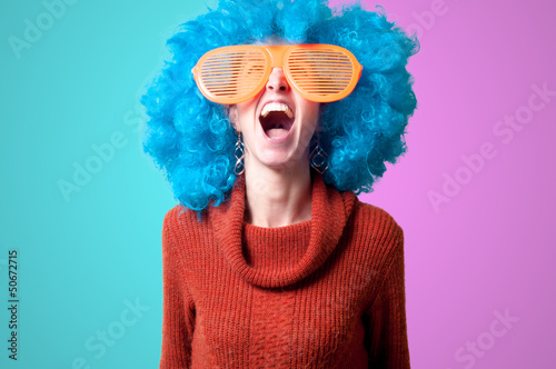 beautiful girl with curly blue wig and turtleneck