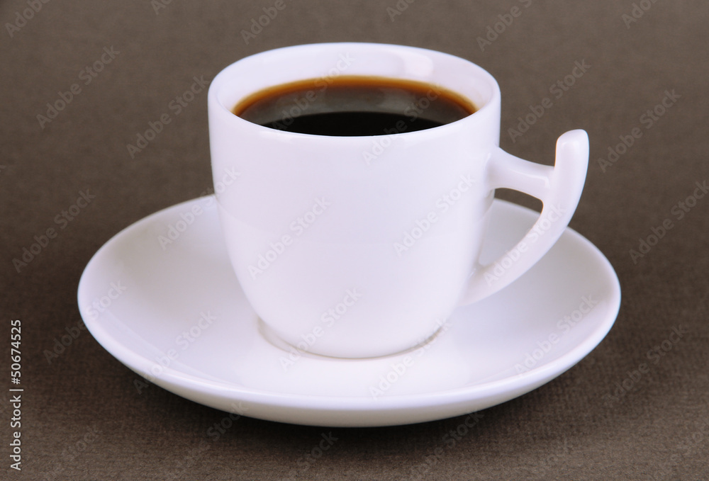 Cup of strong coffee on grey background