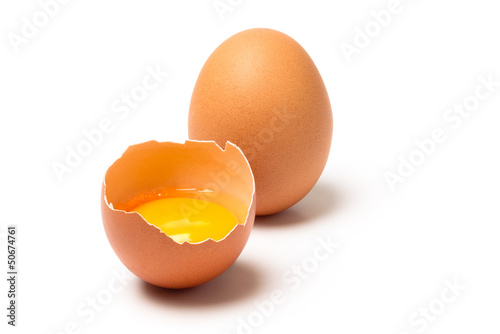 Two brown eggs isolated on white background