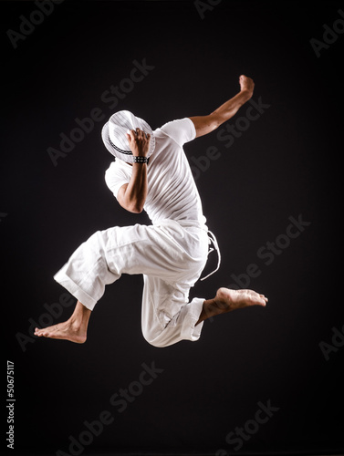 Dancer dancing dances in white clothing