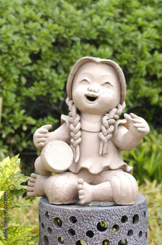 girl statue in garden