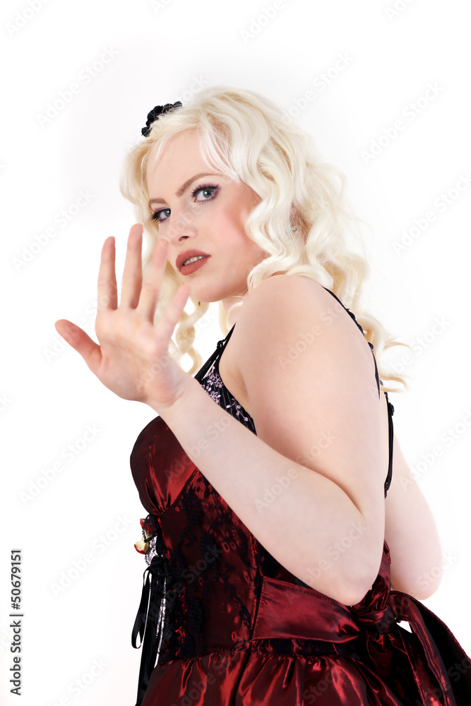 Blonde woman in fearful defense posture forming