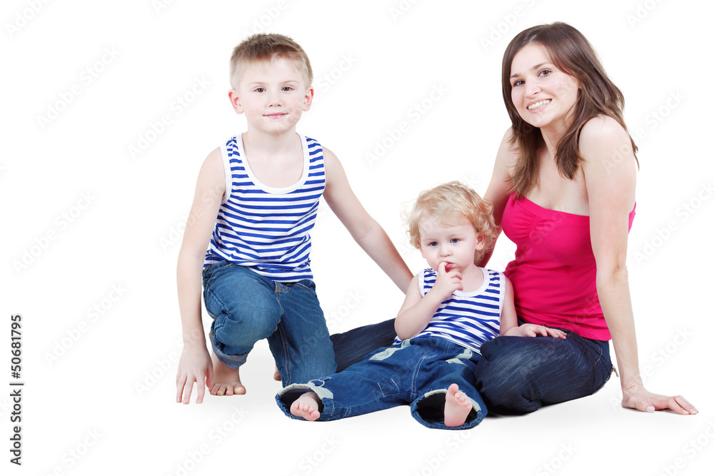 Mother and two sons in striped singlets sit on floor Mother and two sons in striped singlets sit on floor