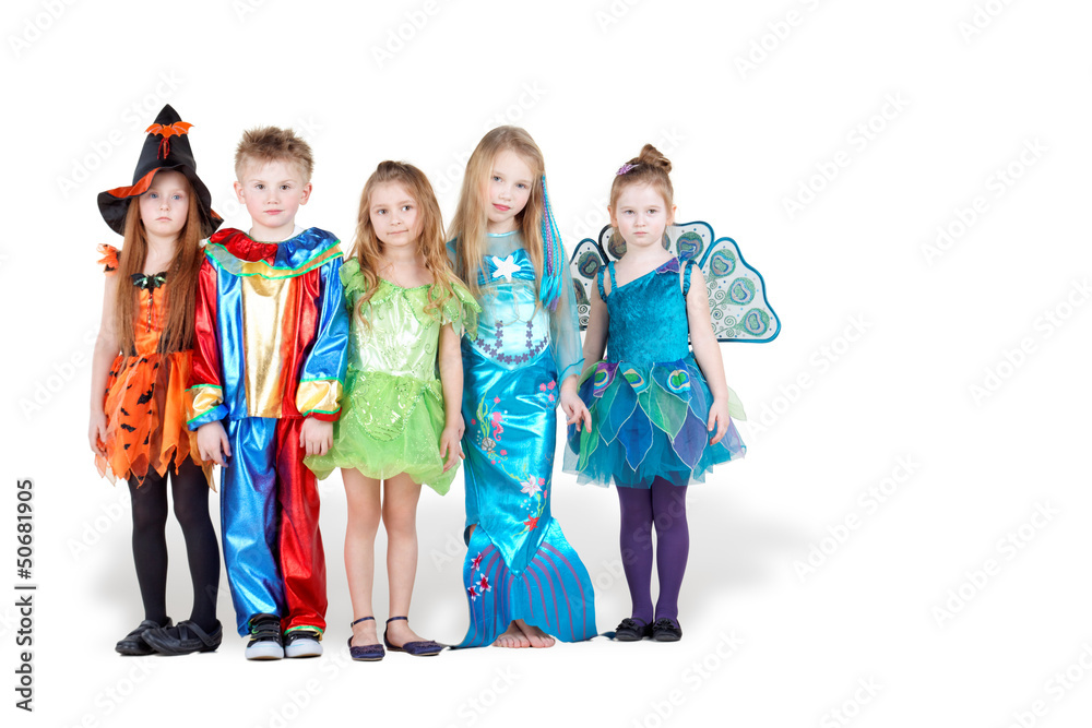 Obraz premium Children in carnival costumes stand in line with serious faces