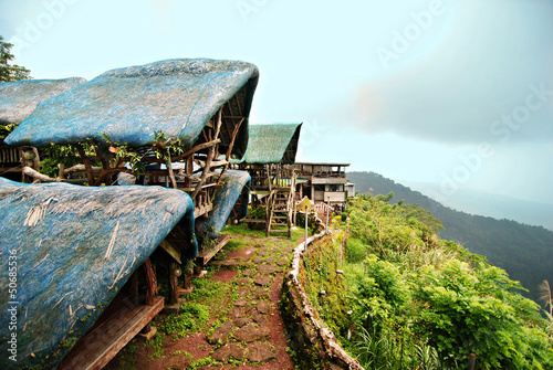 Open huts overlooking a steep cliff in the Philippines