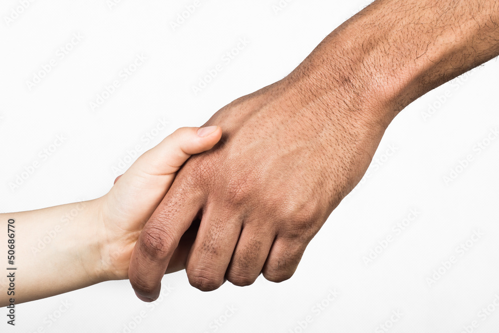 Handshake between white child and black man Handshake between white child and black man