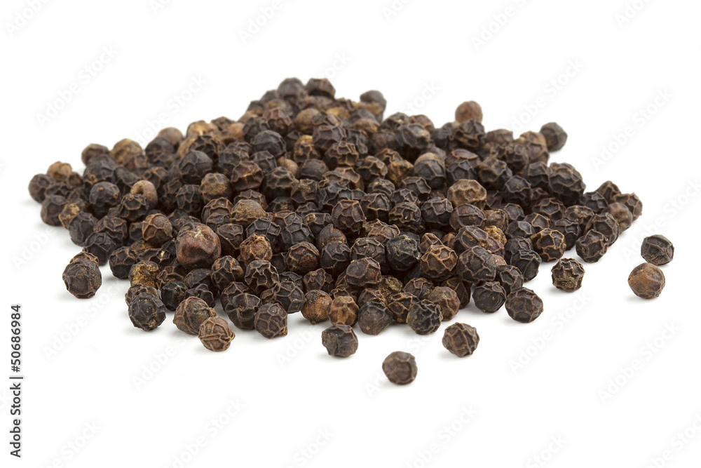 heap of black peppercorns heap of black peppercorns