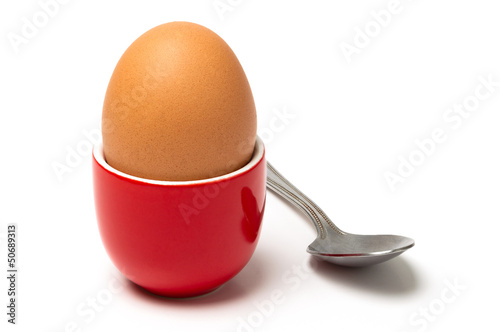 Egg in cup isolated on white background