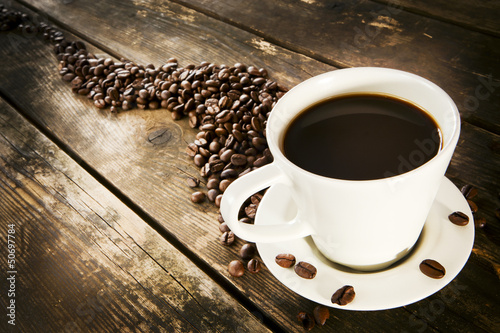 Cup of coffee on a rustic wooden table.