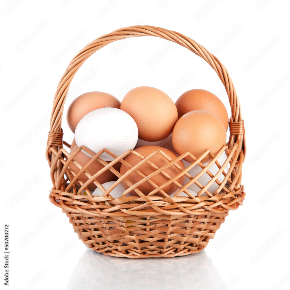 Eggs in a basket isolated on a white background Eggs in a basket isolated on a white background