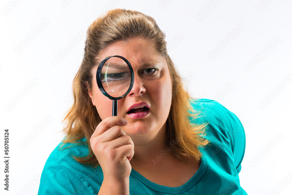 Woman looking through magnifying glass or loupe Woman looking through magnifying glass or loupe